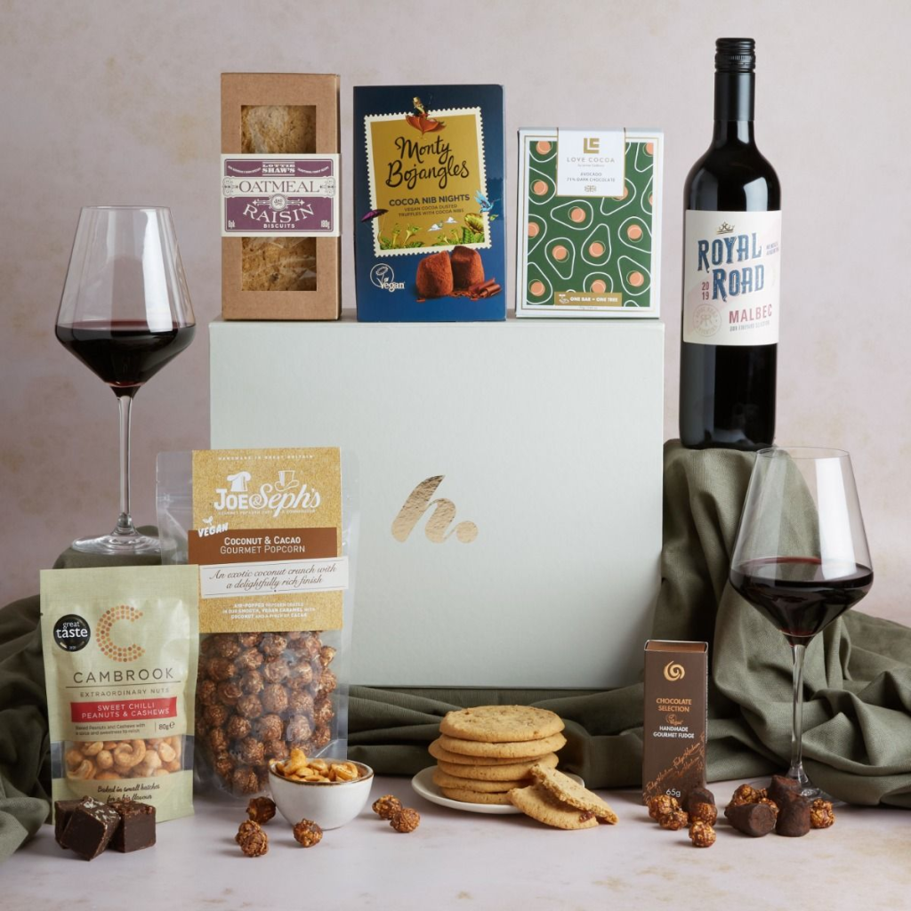 This image shows a corporate thank you gift for clients - a gift hamper filled with artisanal food and drinks.