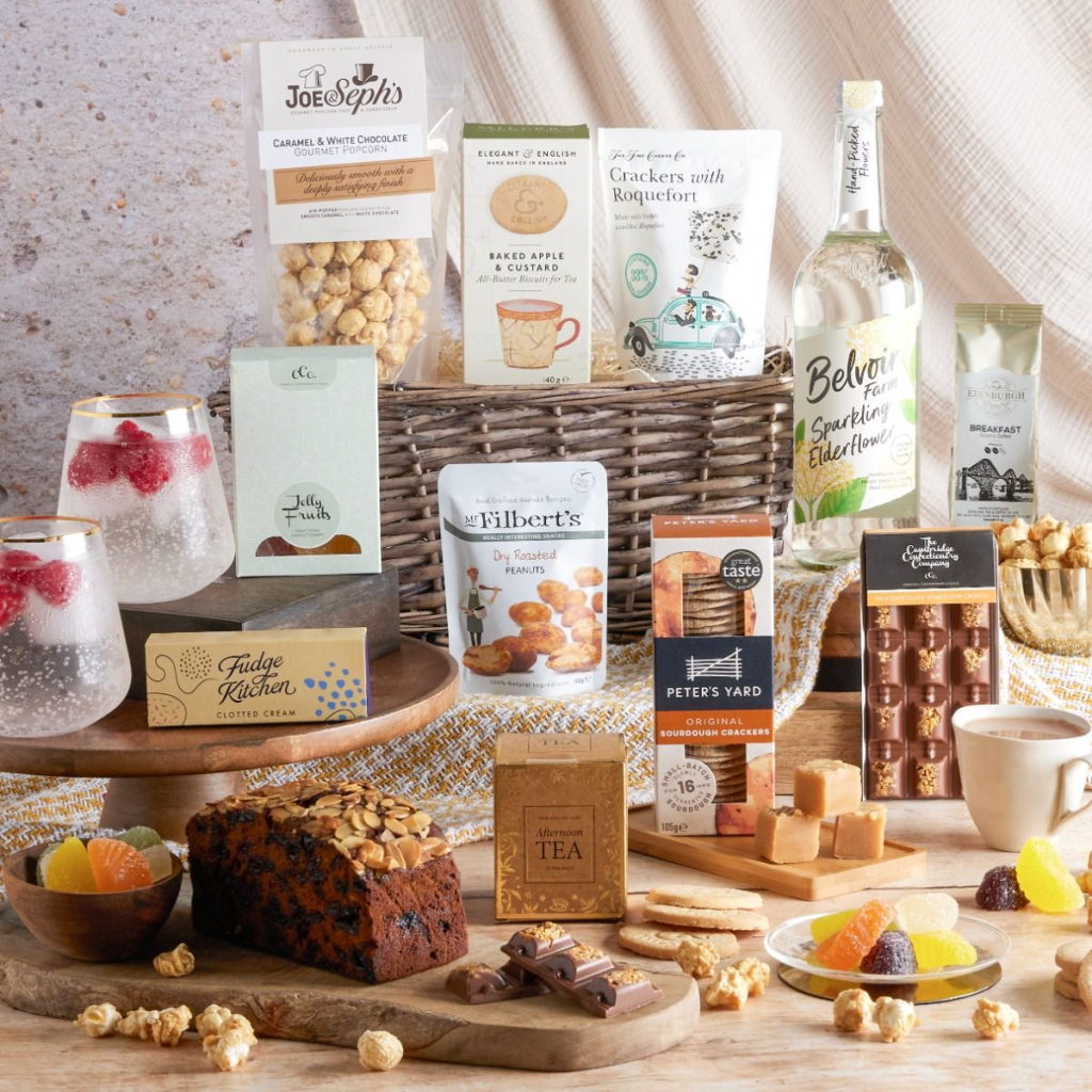 This image shows a corporate gift designed for an employee milestone, packed with artisanal foods and drinks.